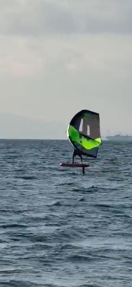 A person windsurfing on a body of water. 5