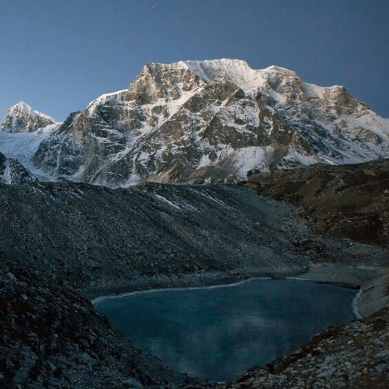 A mountain range with a lake at its base. 3