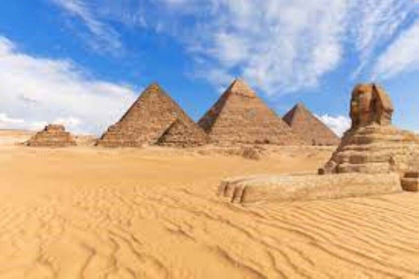 The Great Pyramids of Giza in the desert with clear skies. 5