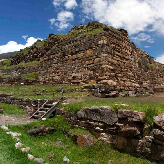 A stone pyramid structure with a staircase leading up to it. 4