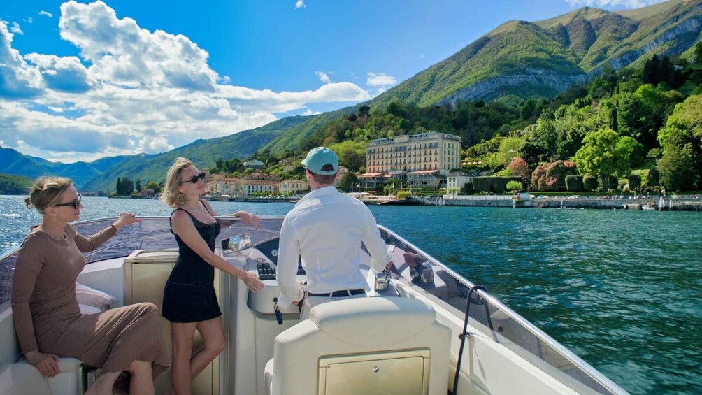 A boat on a lake with mountains in the background. 4
