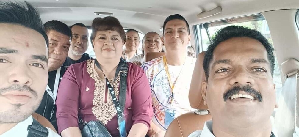 A group of people inside a vehicle. 5