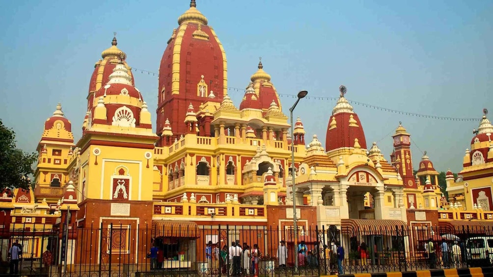A large temple with multiple domes and spires, featuring intricate architectural details and vibrant colors. 5
