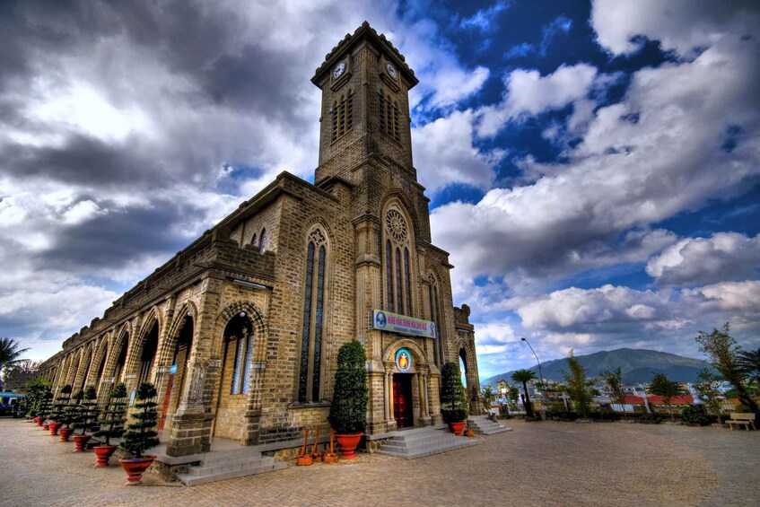 A historic church with a tall tower and arched windows. 2
