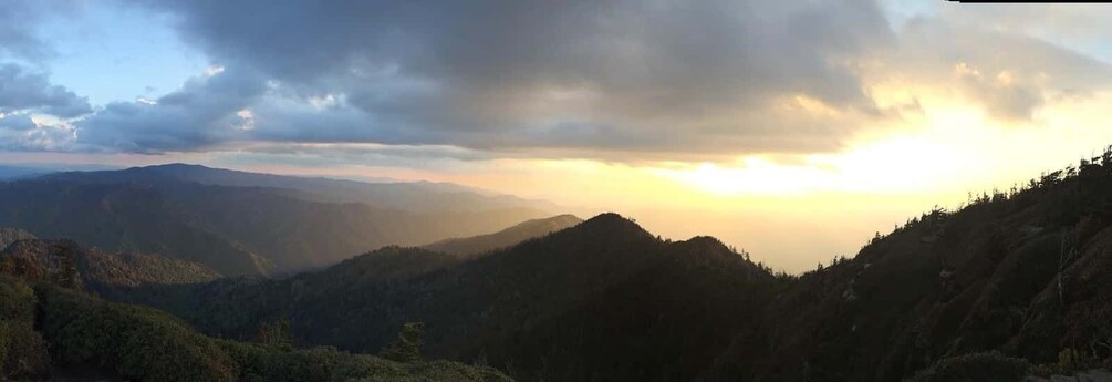 A mountainous landscape with a sunrise or sunset. 4