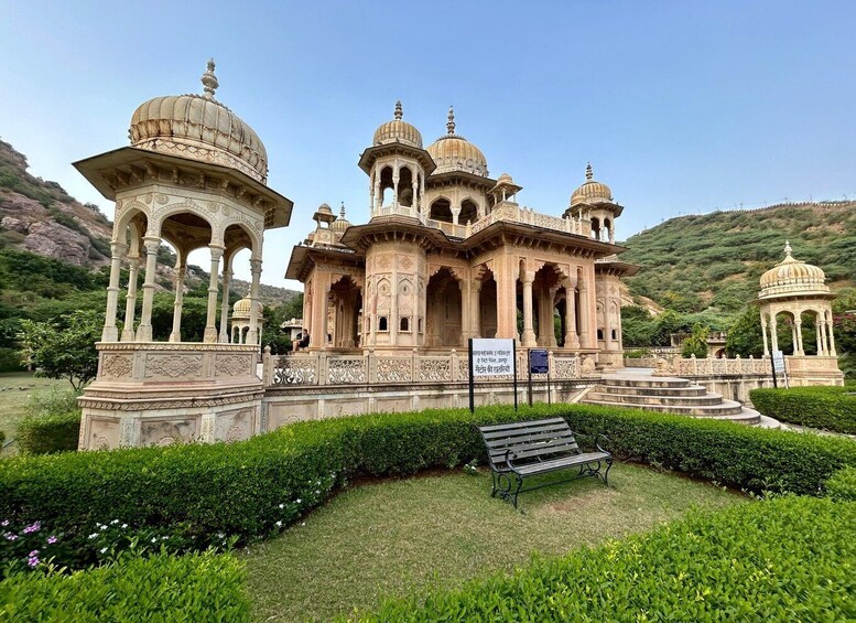 A historic building with domed structures and intricate carvings. 1