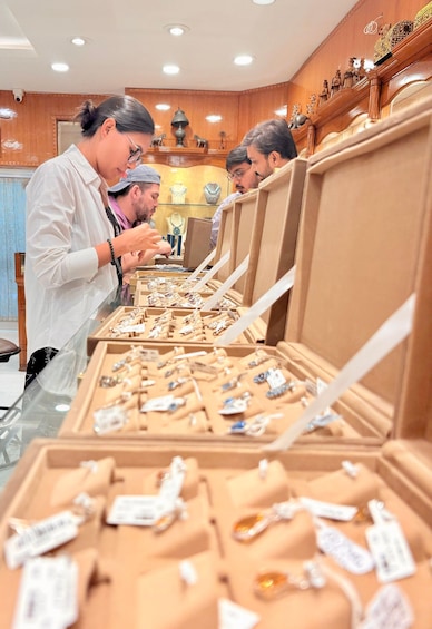 A jewelry store with display cases of various jewelry items. 4