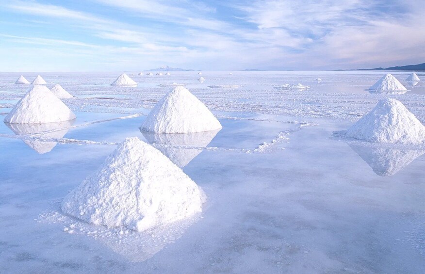 Snow-covered pyramids in a frozen landscape with a clear sky. 5