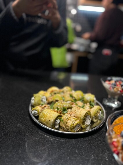 A plate of stuffed vegetables garnished with herbs. 3