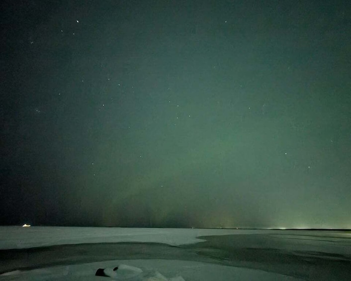 A snowy landscape at night with a starry sky. 5