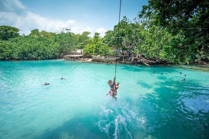 Double the fun! A tandem rope swing into Vanuatu’s Blue Lagoon. 5
