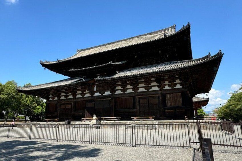 A traditional Japanese building with a curved roof and wooden structure. 2