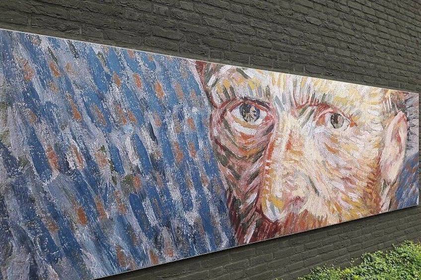 A painting with abstract blue and orange patterns and a partial portrait. 5