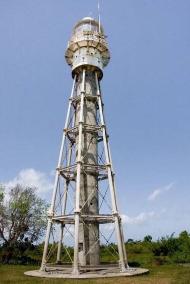 A tall, cylindrical tower with a dome on top, surrounded by scaffolding. 4