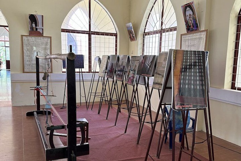 An art gallery with easels and paintings. 2