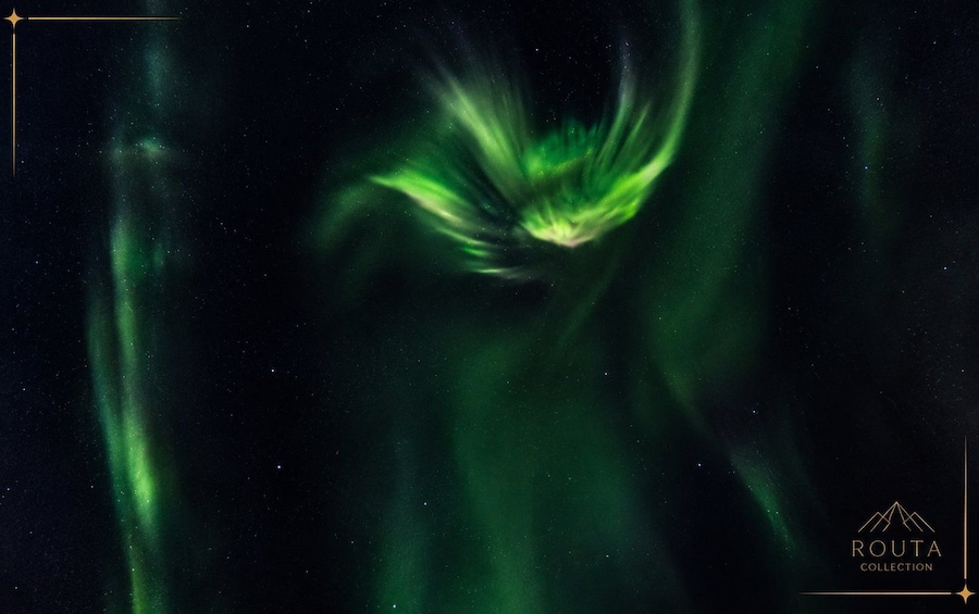 The Northern Lights (Aurora Borealis) with a visible green glow and dynamic patterns against a dark night sky. 3