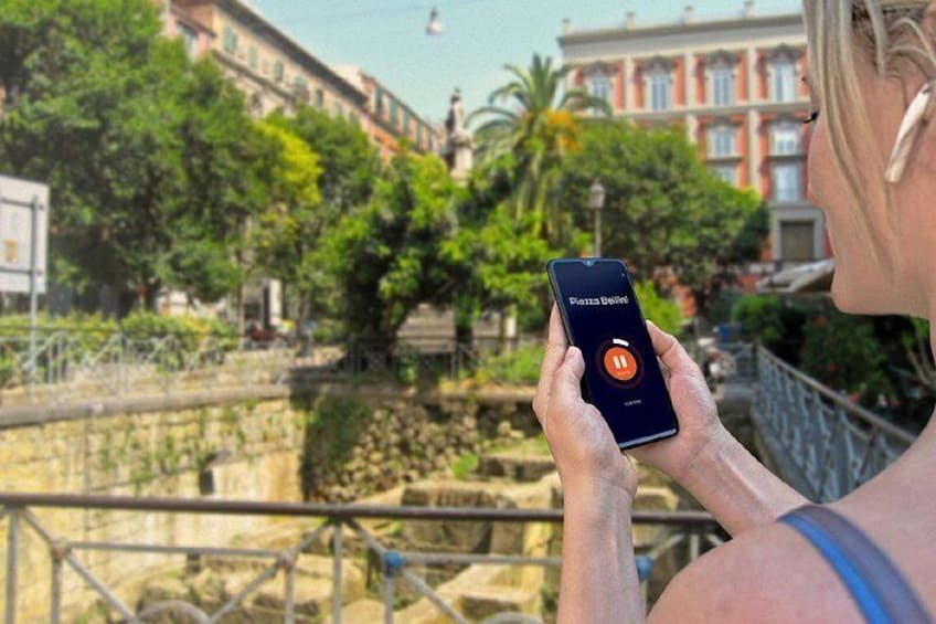 A person holding a smartphone with an app interface. 5