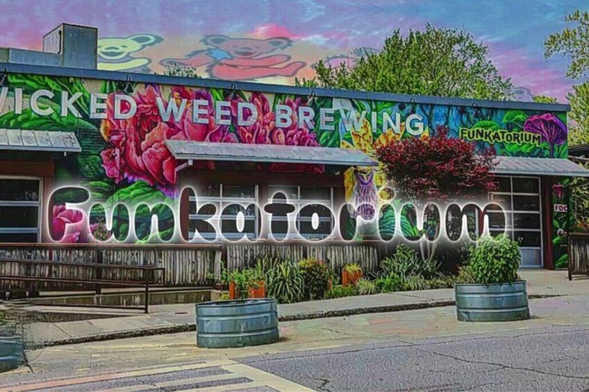 A building with a colorful mural and the name 'Funkaforum' prominently displayed. 2