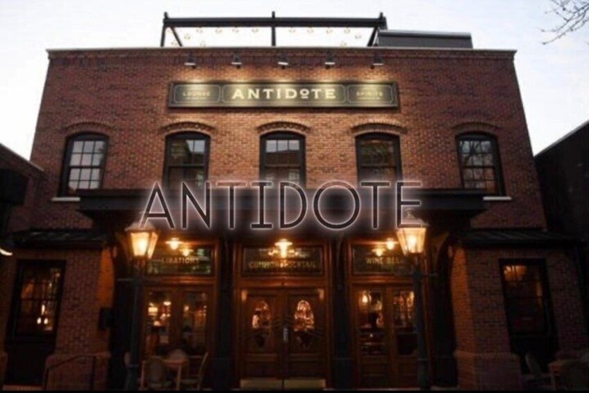 A brick building with the sign 'ANTIDOTE' above the entrance. 2