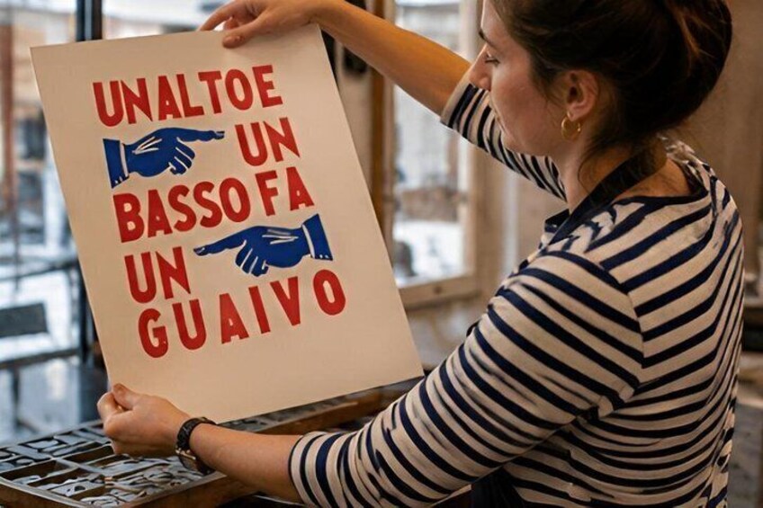 A person holding a sign with text and hand illustrations. 3