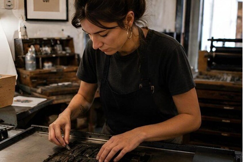 A person working with a machine, possibly in a workshop or industrial setting. 1