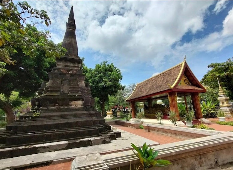 A temple complex with a large stupa and a smaller shrine. 2