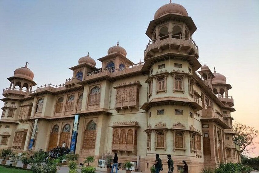 A large, ornate building with multiple domes and arched windows. 4