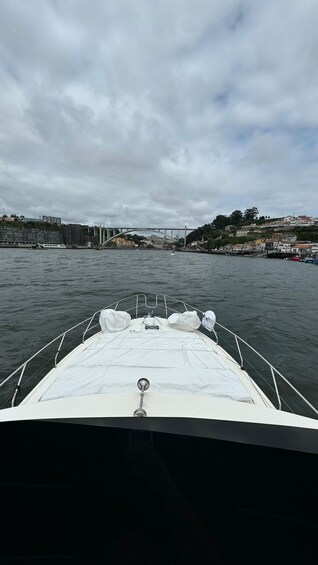 A boat on water with a cityscape in the background. 2