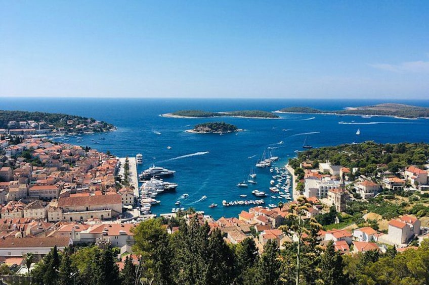 A coastal town with a marina, boats, and buildings. 2