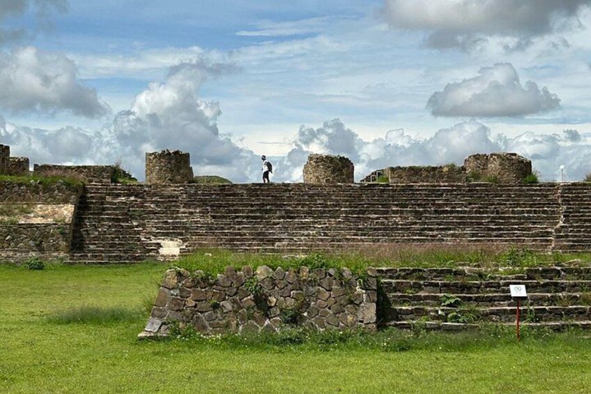 Ancient stone walls and ruins with a person standing on top. 2