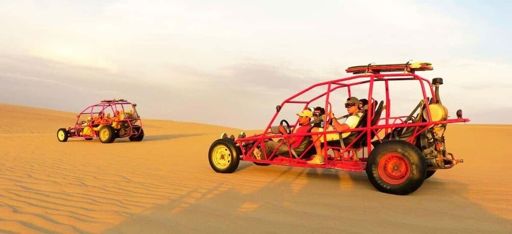 Two off-road vehicles in a desert landscape. 3