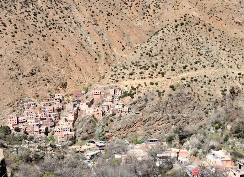 A village nestled in a mountainous region with terraced buildings. 3