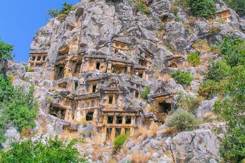 A rock-cut monastery complex with multiple chapels carved into the hillside. 1