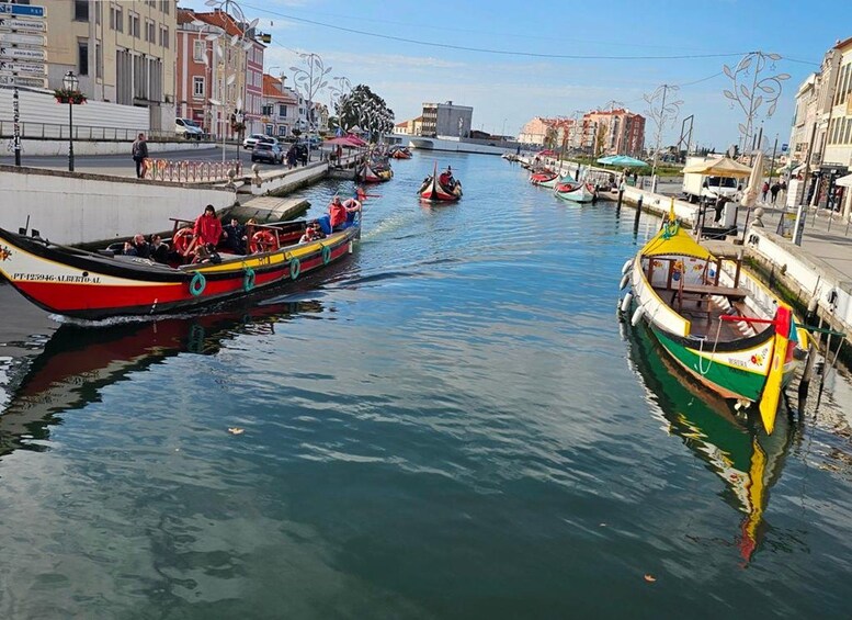 A canal with boats, buildings, and a clear sky. 3