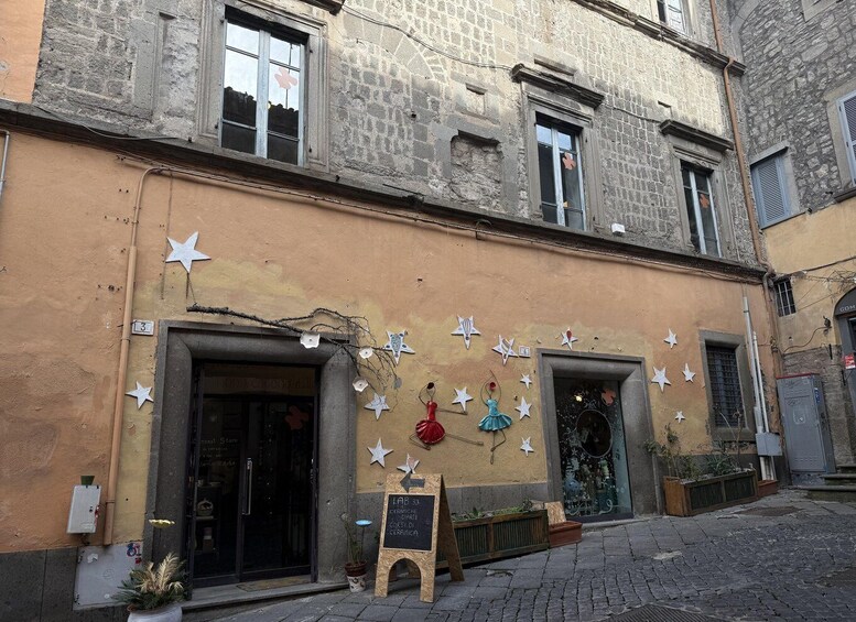 A building with star decorations and a signboard. 5
