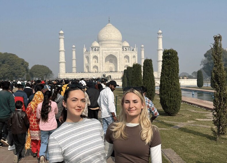 The Taj Mahal with visitors in the foreground. 2