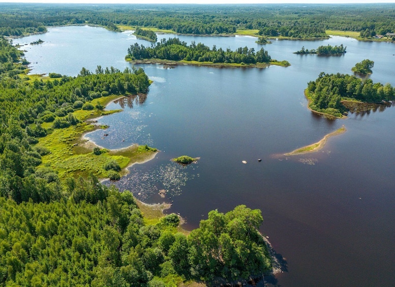 A large lake surrounded by dense forests and multiple small islands. 1
