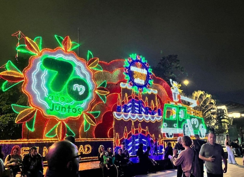 A brightly lit float with neon lights and the number 350. 2