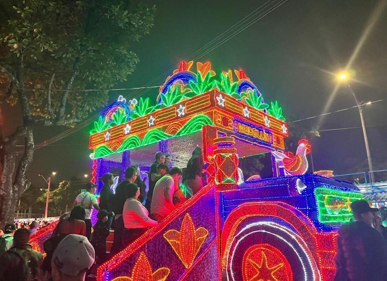 A brightly lit, colorful parade float with intricate designs and patterns. 4