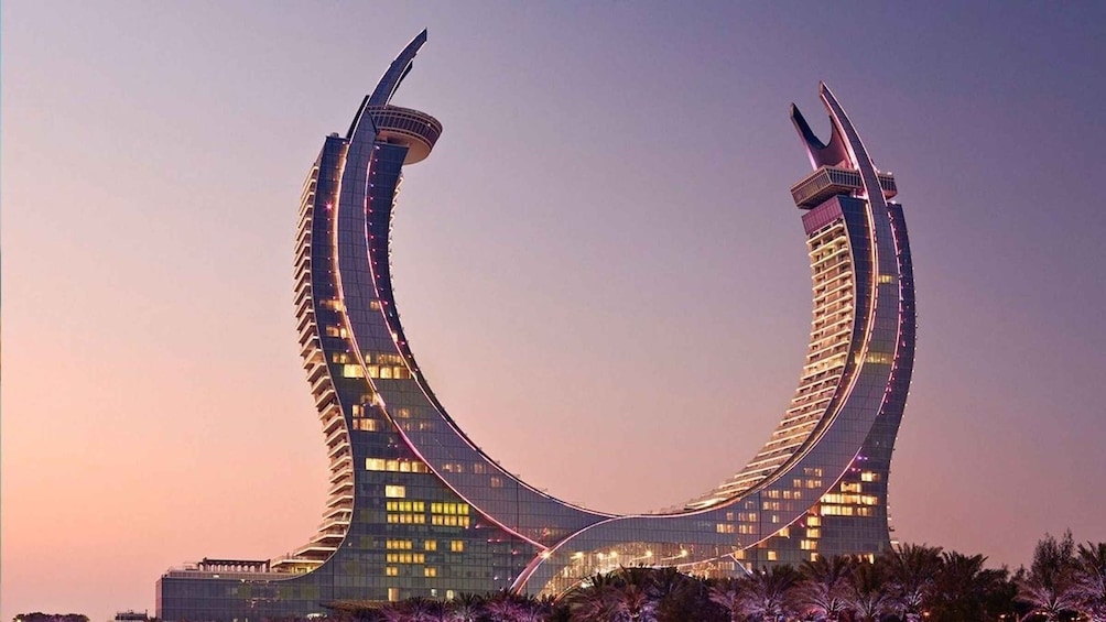 A modern architectural building with a distinctive curved design. 5
