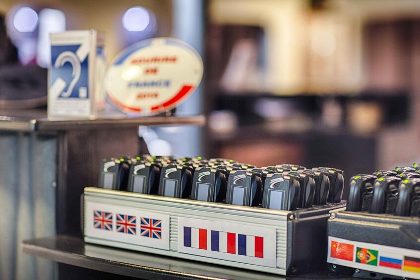 A display of mobile phone chargers with flags of the UK, France, and Brazil. 3