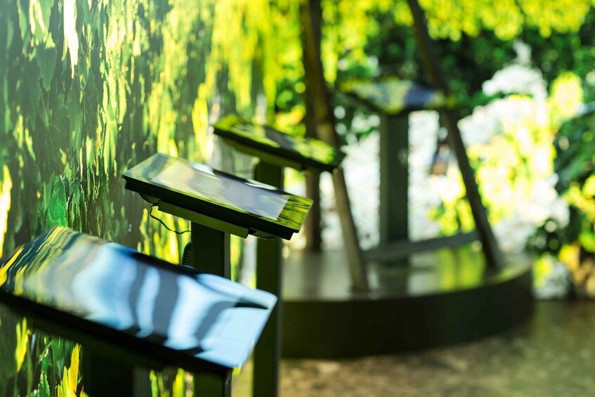 A park bench with a metal frame and a reflective surface. 5