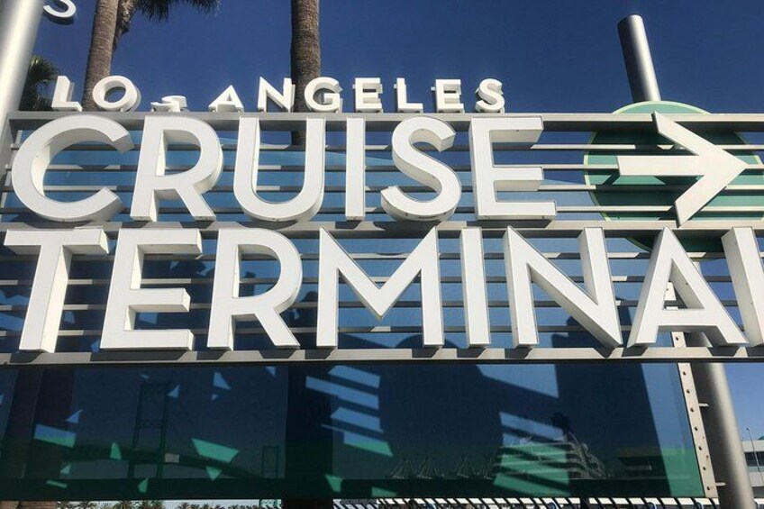 A sign for the Los Angeles Cruise Terminal with an arrow pointing right. 1