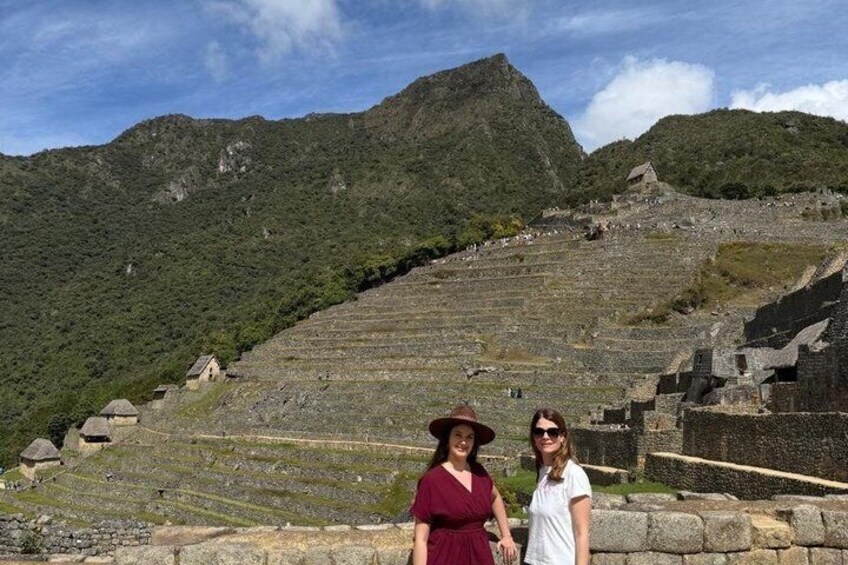 A historical site with terraced structures and a mountain backdrop. 3