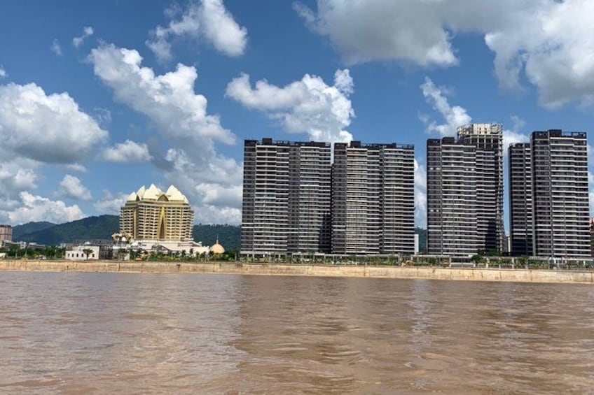 A river with buildings in the background. 1