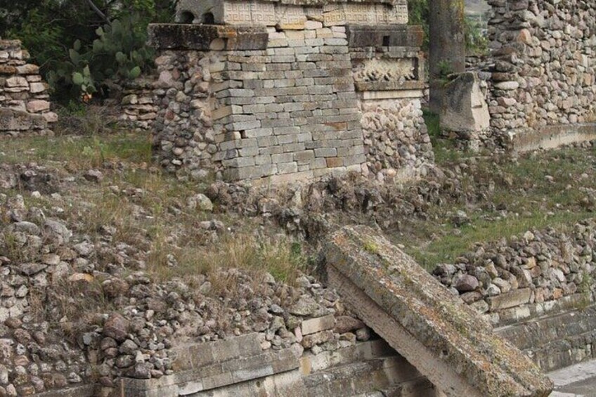 Ancient ruins with stone walls and a stone staircase. 4