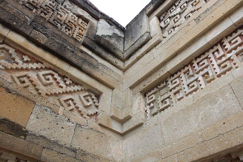 A stone structure with carved geometric patterns. 3
