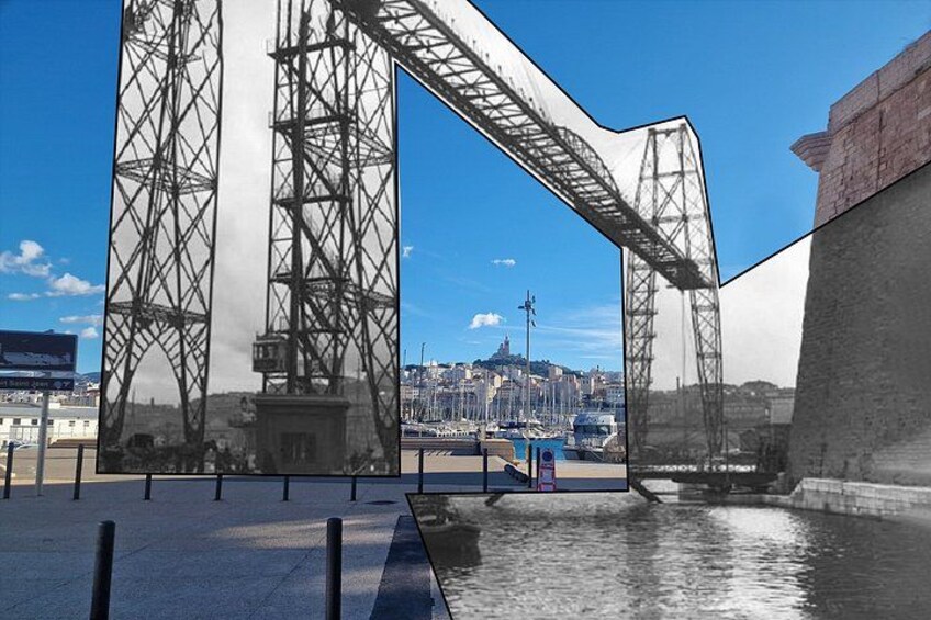 A large steel bridge with a curved section, a body of water, and a cityscape in the background. 4