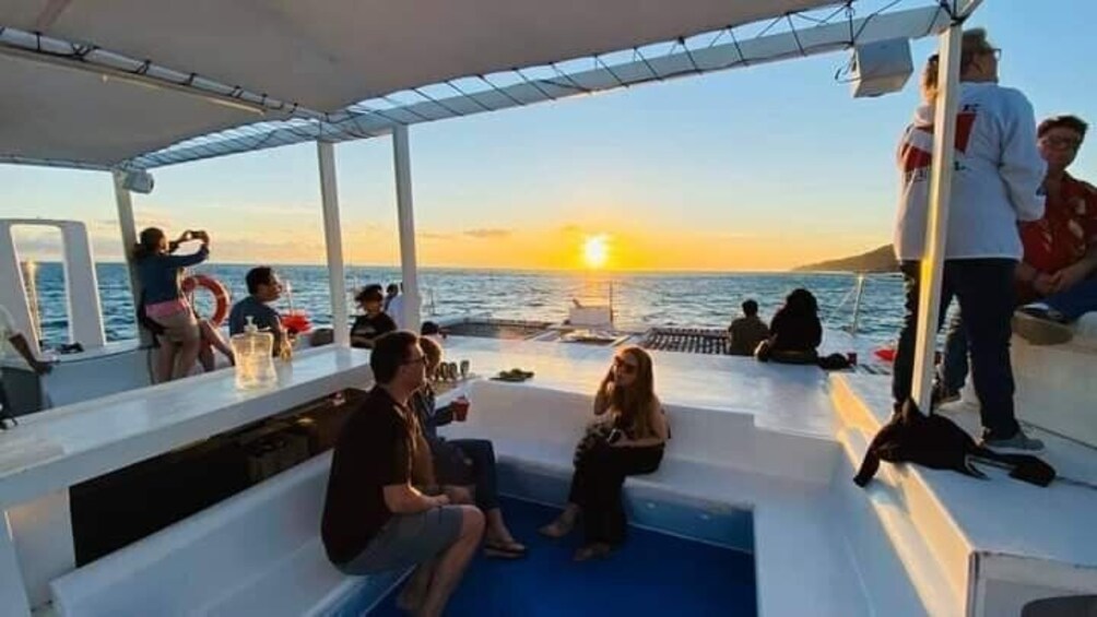 People on a boat at sunset. 3