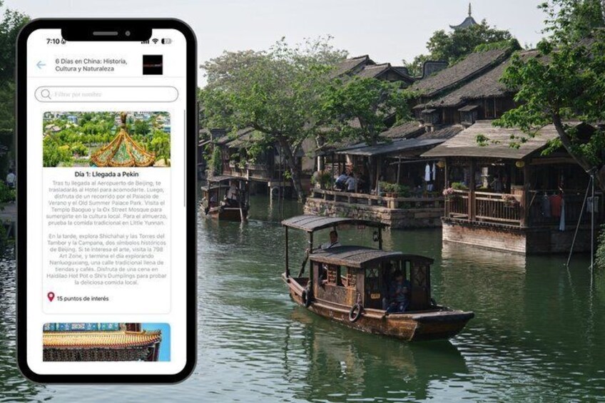 A traditional wooden boat on a river with old-style buildings in the background. 4
